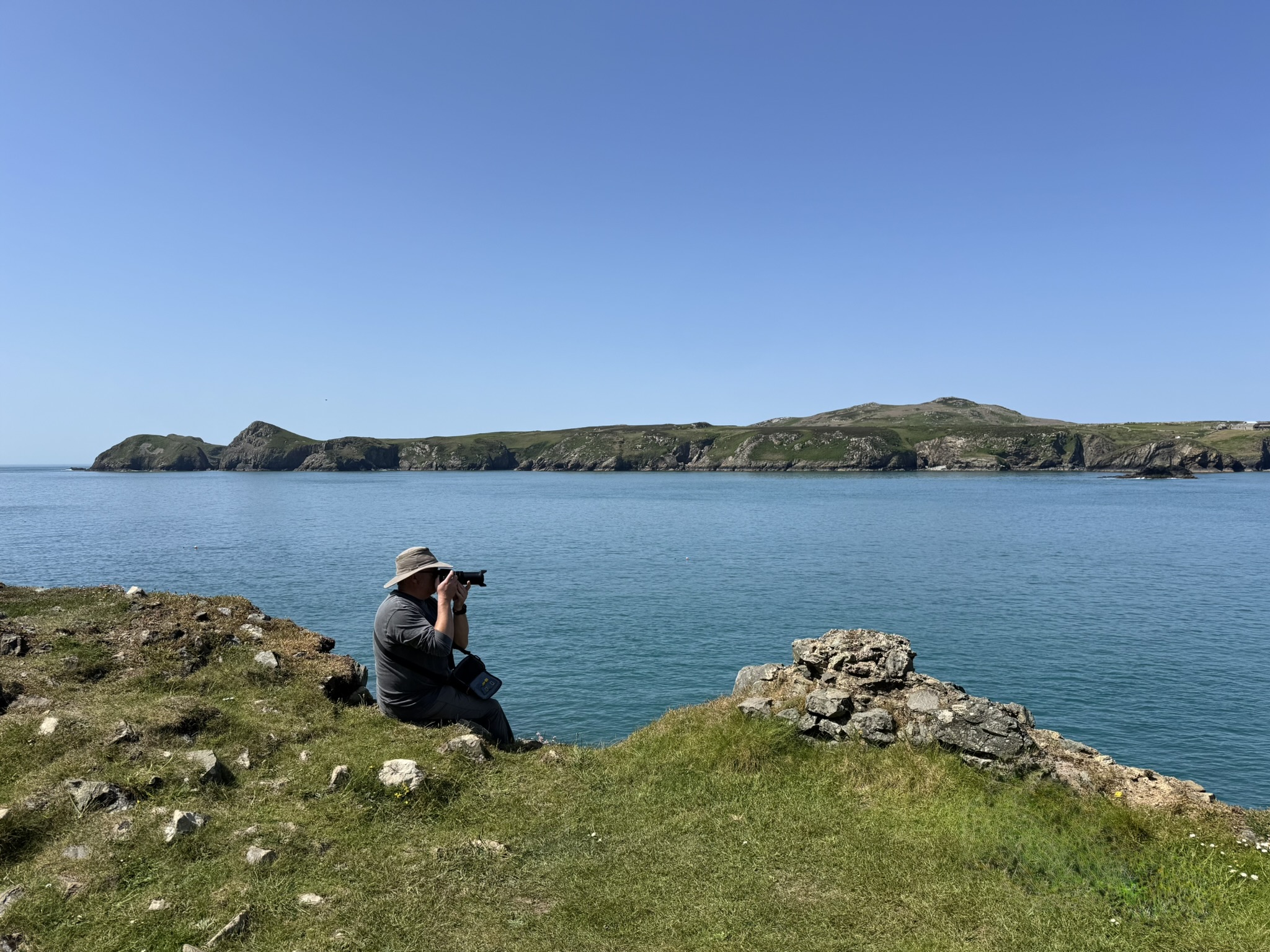 Person with camera at St Justinians